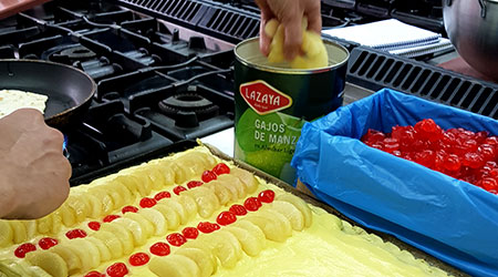 Making an apple pie with Lazaya's delicious apples in syrup cut in segments.